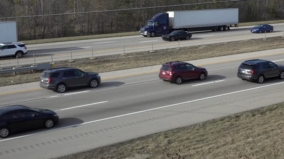 Cars and trucks driving on highways