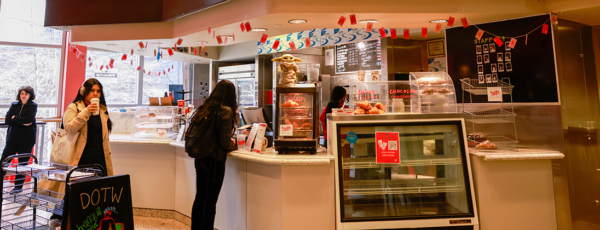 Wide-angle image of William’s Cafe's front area, showcasing the vibrant atmosphere and a bustling coffee shop environment.