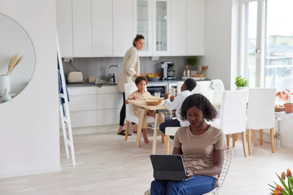 Family working and having meal at home