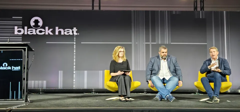 Matthew Martin, chief information security and privacy officer at Western Carolina University, Ron Keesing, former chief AI officer at Leidos and now a consultant at Keesing LLC, and Forrester principal analyst Jess Burn speak at a panel at Black Hat USA 2026