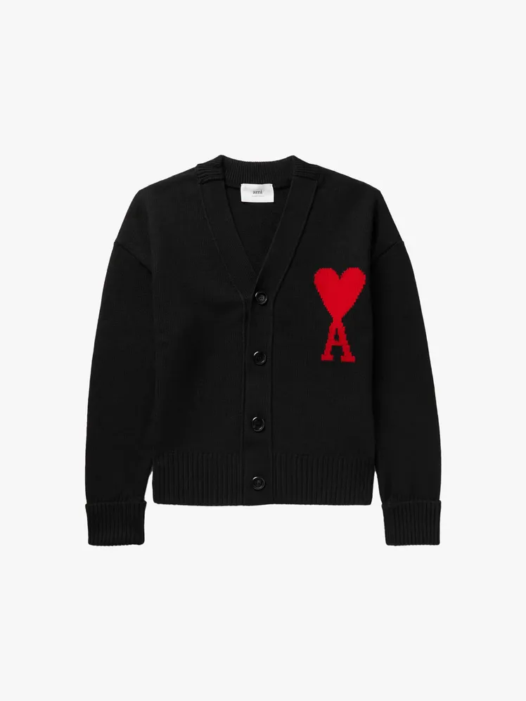 Image may contain Clothing Knitwear Sweater Coat and Cardigan