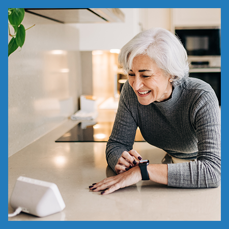 A woman listening on a smart speaker