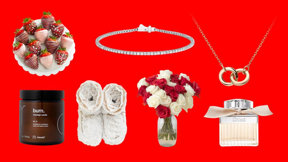 An assortment of Valentine's Day gifts on a red background