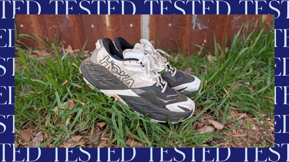 Hoka Speedgoat 7 in black and white on grass