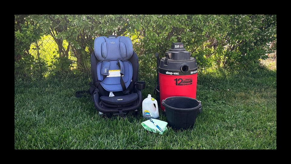 a car seat with cleaning supplies