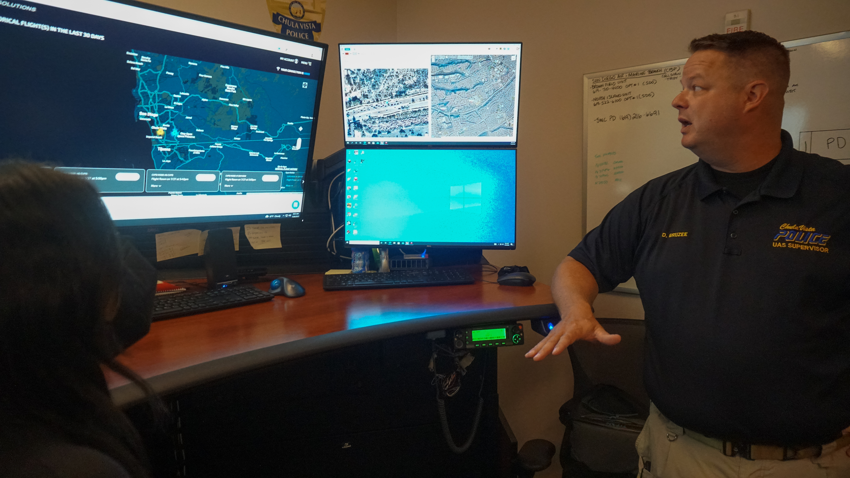 An Chula Vista Police Department officer shows on a computer monitor a map with drone flights. 
